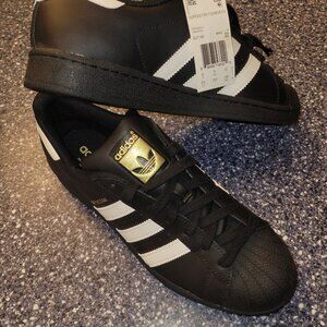 Adidas superstars foundation black and gold with white stripes